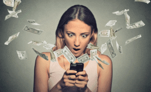 surprised woman staring at phone while dollar bills fly – symbol of high media value Instagram payouts