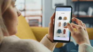 NA‑KD influencer marketing hero – customer browsing fashion items on a mobile shopping app