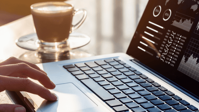 influencer research database hero – laptop with analytics dashboard and coffee